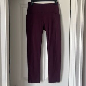 Athleta leggings with slit at ankle in dark maroon/purple